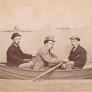 Four men in a fake rowing boat